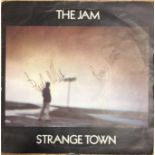 THE JAM STRANGE TOWN SIGNED 7".