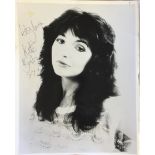 KATE BUSH. An 8x10" promotional photograph with inscription and signature by Kate Bush.