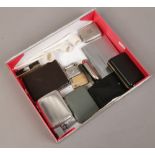 A box of smoking related lighters, cases, clay pipes etc.