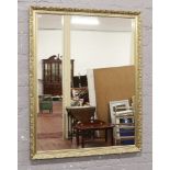 A large gilt framed wall mirror 85cm x 110cm.