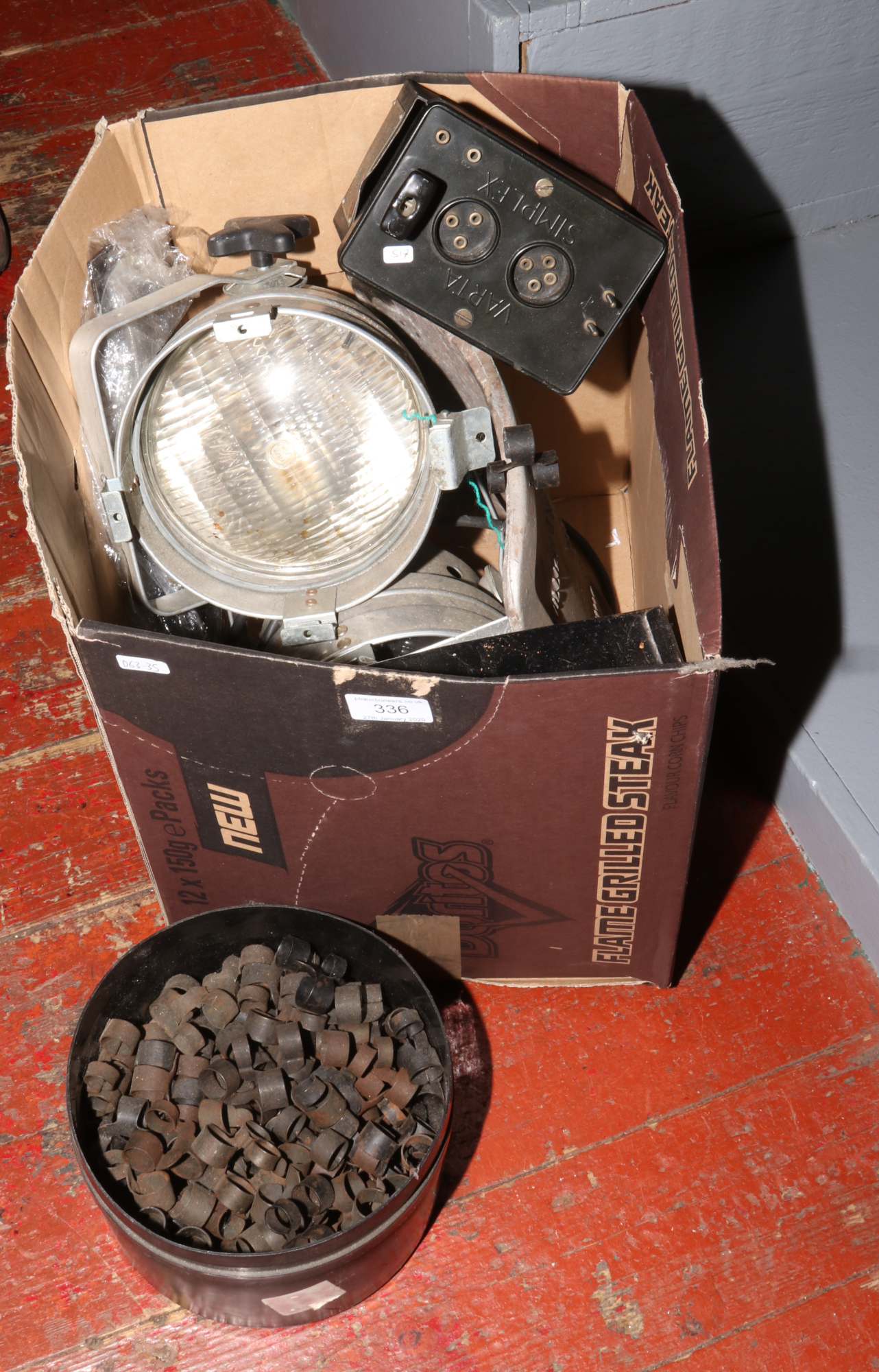 A box of miscellaneous to include bullet clips, theatre lights etc.