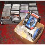 A large hard C.D case to include a collection of C.Ds and a box of electrical equipment to include