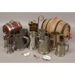 A mixed group to include spirit kegs, pewter tankards, brass measuring vessel etc.