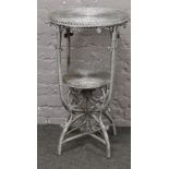 A basketware two tier side table.
