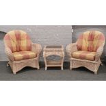 A pair of basket ware conservatory arm chairs with tartan upholstery, along with a matching two tier