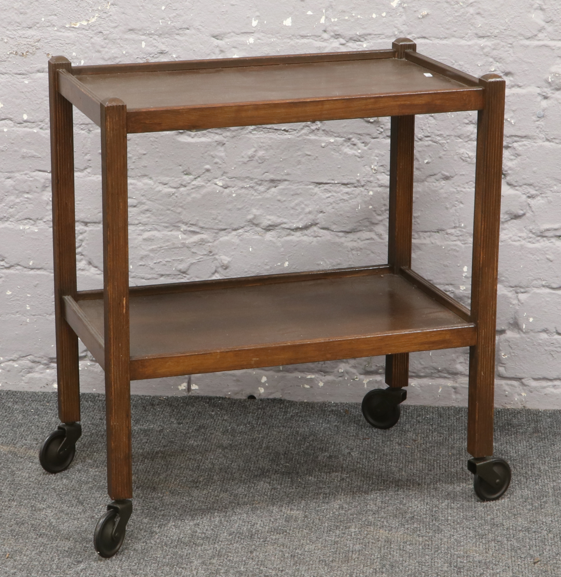 A wooden two tier hostess trolley.