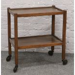 A wooden two tier hostess trolley.