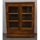 A panelled mahogany display cabinet with lower drawer and key, 96cm width x 120cm height x 42cm