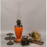 A collection of metalwares to include coffee grinder, brass dinner gong, rotating stand and amber