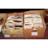 Two boxes of single records to include The Beatles, Elvis Presley, Queen etc.