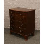 A mahogany bow front chest of four drawers raised on splayed bracket fee with oak lined drawers,