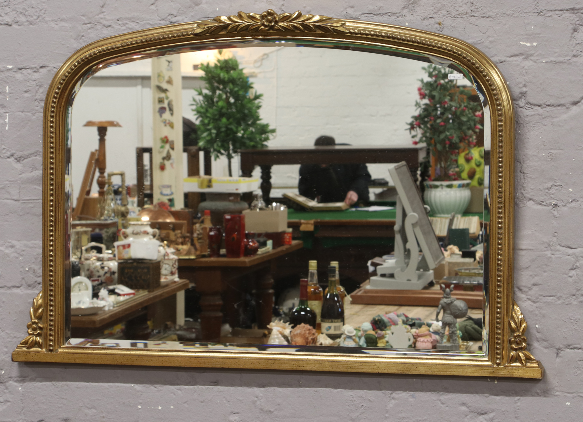 A bevel edge gilt framed over mantle mirror, 70cm x 105cm.