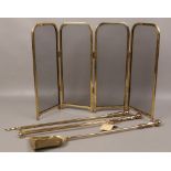 A brass fireside companion set, along with a brass spark guard.