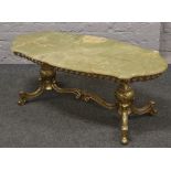 A brass and onyx coffee table.