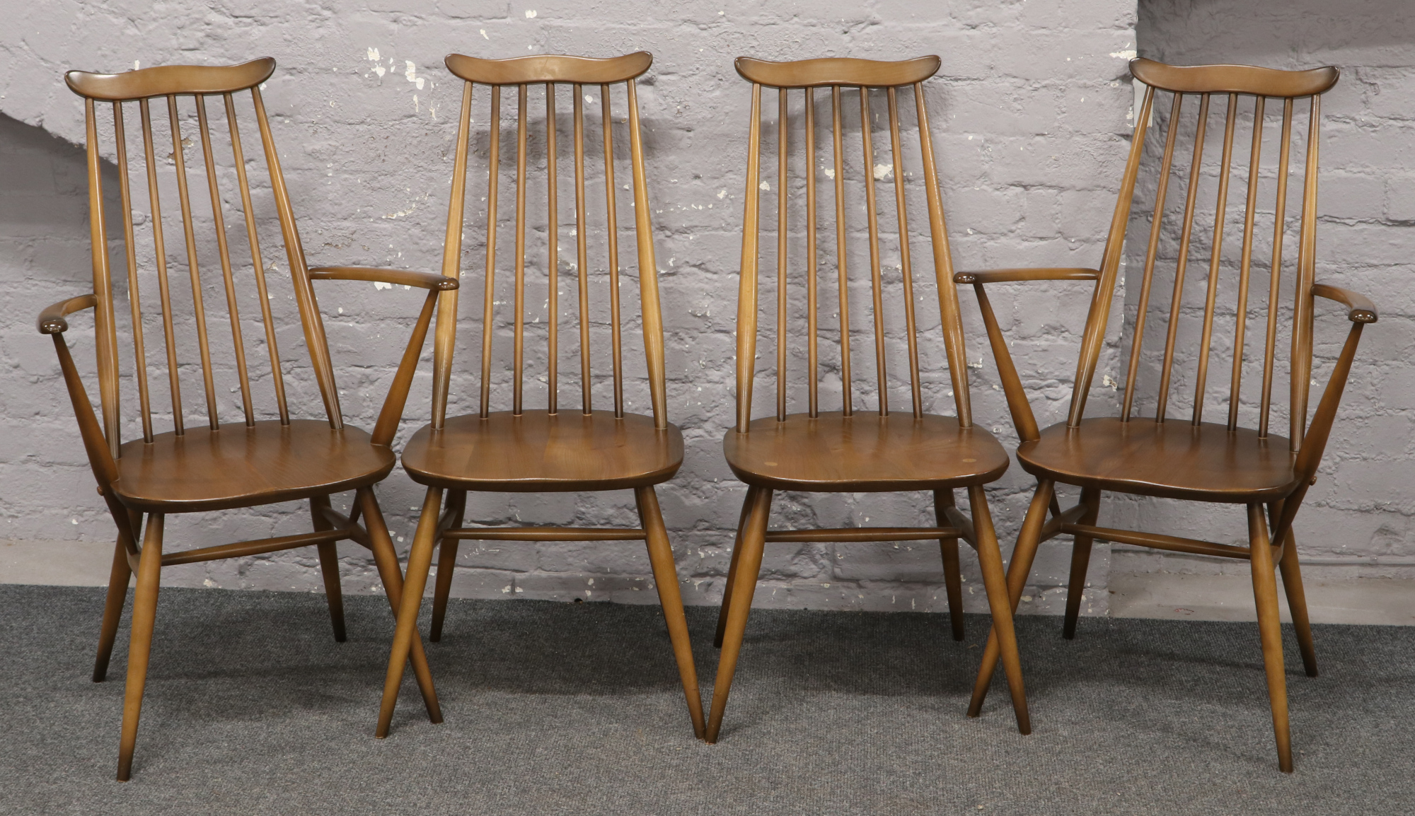 Four Ercol Golden Dawn Goldsmith chairs to include two carvers.