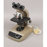 A Vickers Instruments electric binocular microscope.