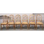 A set of six Continental carved chairs raised on cabriole legs and with canework seats c.1920s.
