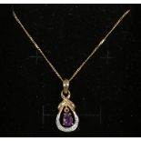 A 9ct gold amethyst and diamond pendant on chain.