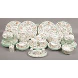 A collection of Minton bone china tea / dinnerwares in the Haddon Hall design, approximately 65