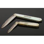 Two Victorian silver fruit knives with mother of pearl scales assayed Sheffield 1841 and 1854.