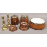 A collection of wooden and metalwares to include oak biscuit barrels, brass candlesticks, jelly
