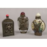 Three Chinese scent bottles to include reversed painted example.