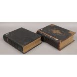 Two leather bound family bibles with coloured plates.