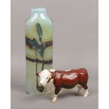A Beswick ceramic model of a Hereford bull (with restoration) along with an Art glass vase bearing
