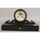 A Victorian slate mantle clock with visible anchor escapement and malachite decoration.