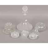 A collection of cut crystal to include decanter, candlesticks, trinket examples.