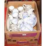 A box of bone china teawares to include Indian tree design various factories and blue and white