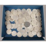 A tray of white metal coins. Including Commonwealth crowns and dollars, thaler and American etc.