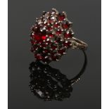 A yellow metal garnet cluster ring, size P 1/2.