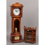 A Glengoyne 200 AD limited edition clock case, height 70cm along with a glazed wooden thimble