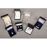 Seven pieces of boxed silver jewellery pendants on chains, earrings etc.