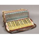 A cased German Pietro piano accordion.