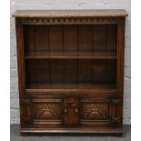 A Titchmarsh & Goodwin open bookcase. With scallop carved frieze and lower cupboards, 84cm wide,