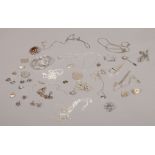 A collection of mainly silver jewellery including St Christopher locket, pendants and earrings etc.