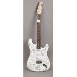 A Chord electric guitar after a Fender Stratocaster original autographed by various musicians from