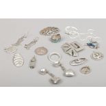 A tray of mainly silver jewellery and charms including earrings and pendants, St Christopher etc.