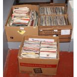 Three boxes of singles, mainly pop music.
