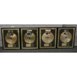 A set of four Beatles limited edition framed gold disc / CD in recognition of world wide success.