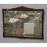 A mahogany framed bevel edge wall mirror 82cm x 64cm.