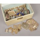 A collection of costume jewellery oddments including gilt chains, simulated pearls and sequined