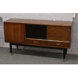 A G plan retro teak sideboard with painted sliding door raised on painted brass foot legs, 144cm x