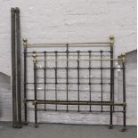 A Victorian brass and iron double bed.