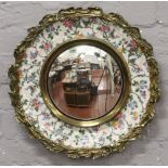 A Burleigh ware convex wall mirror with gilt and floral design.