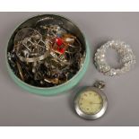 A vintage confectionery tin and assorted costume jewellery and a ladies Rotary wristwatch.