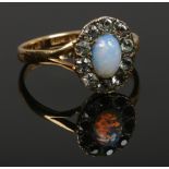 A ladies 22ct gold opal / white paste cluster ring, size O gross weight 4.11 grams.