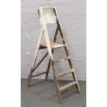 A set of wooden decorators ladders.